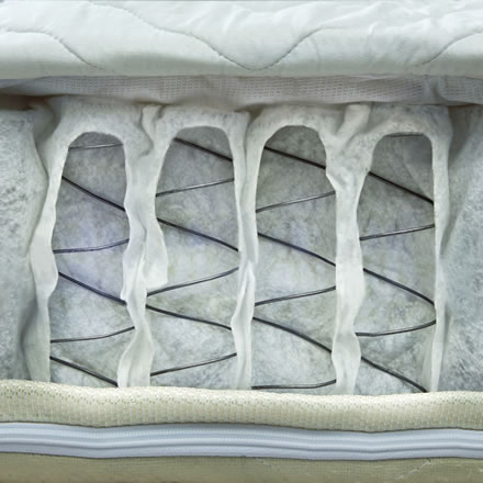 A close-up view of the inner spring coil technology used in a semi truck sleeper mattress, showcasing the durable and supportive construction designed to provide comfort and longevity for long-haul truckers.